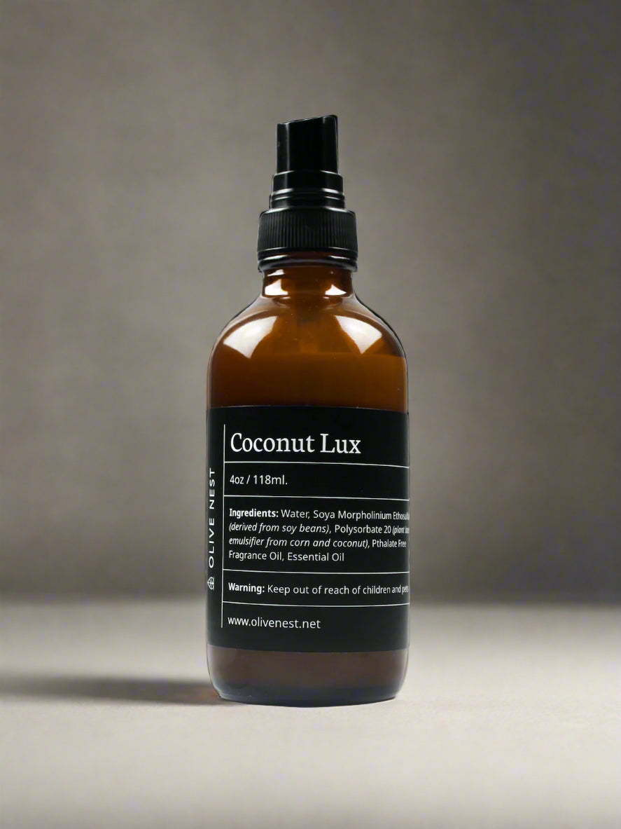 Coconut Lux in sleek brown bottle with black atomizer and label